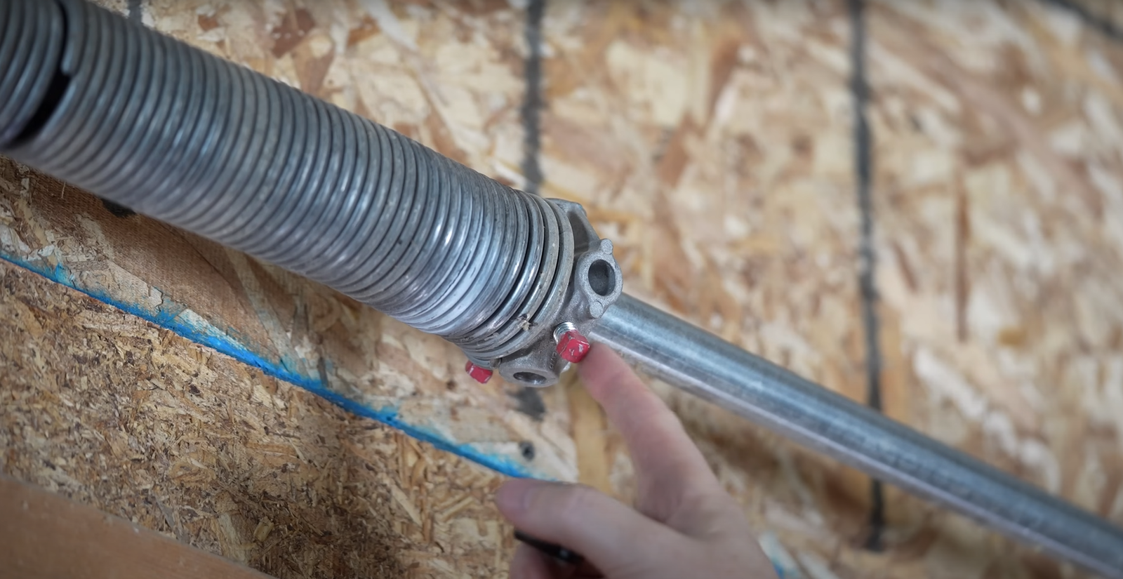 Damaged garage door spring causing system failure, highlighted by Myakka City Garage Door Repair.