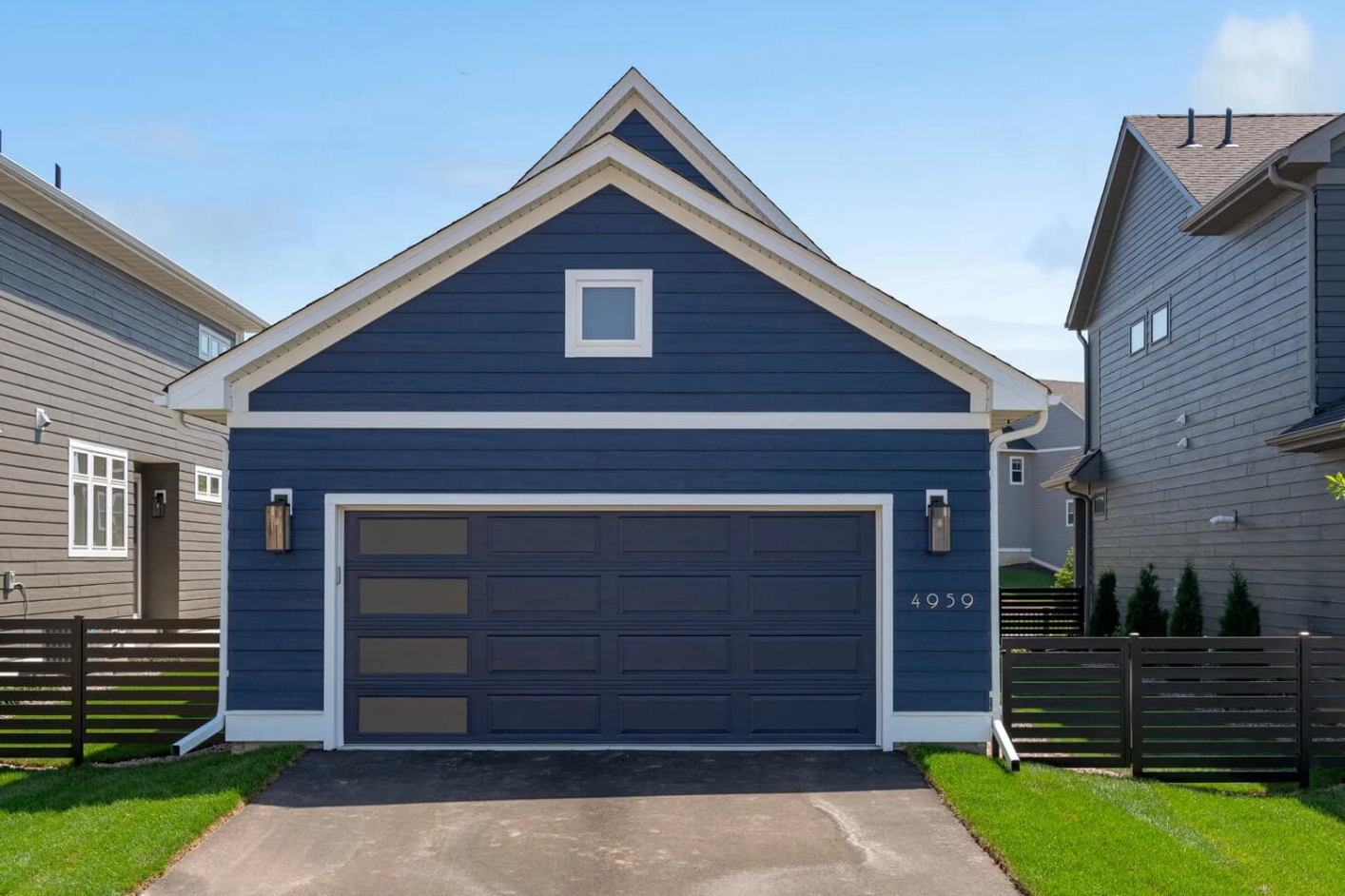 "Custom-designed garage door installed by Myakka City Garage Door Repair, featuring a modern wood finish and durable steel frame for enhanced curb appeal and functionality."