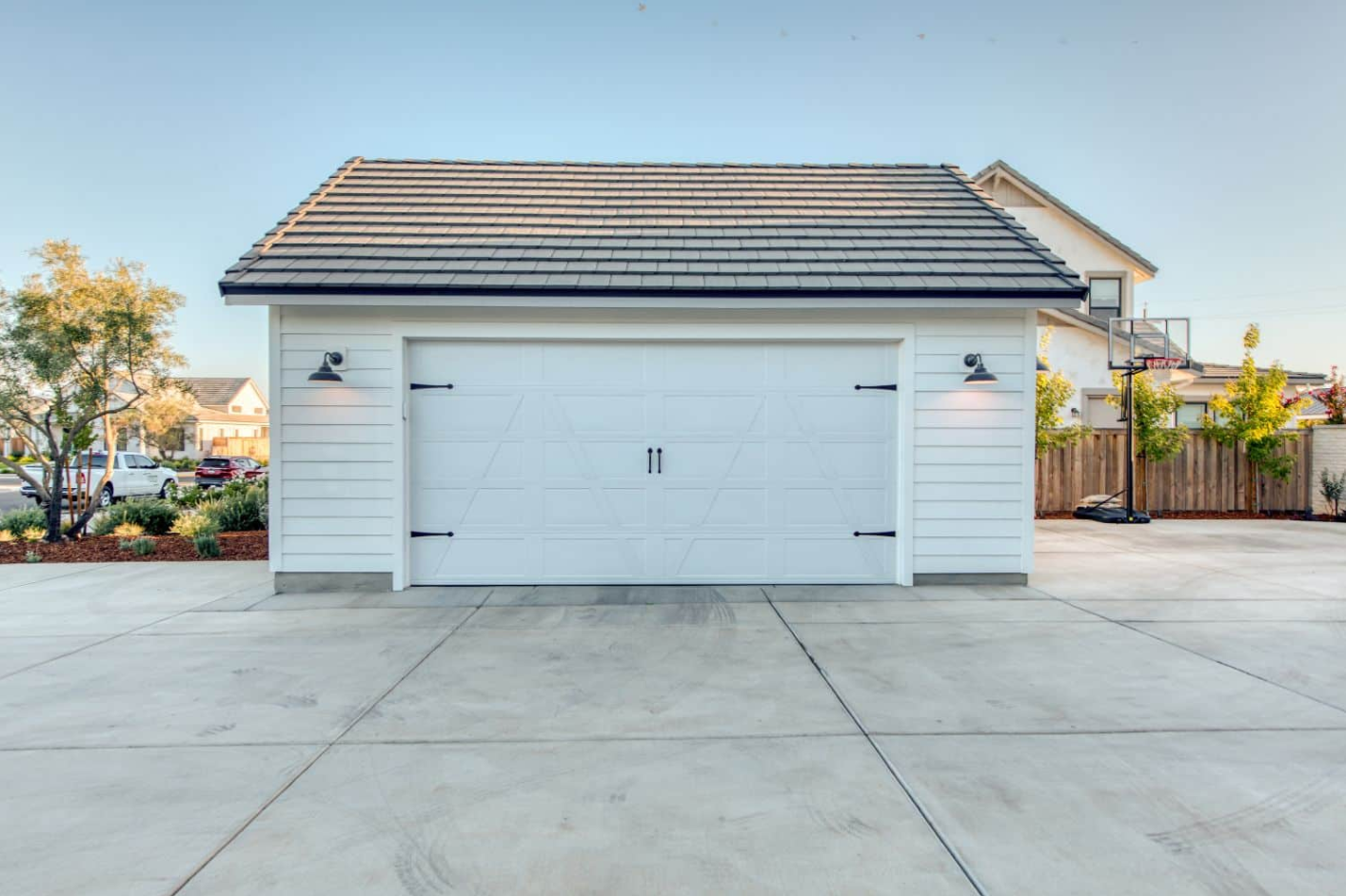 A professional garage door technician performing a detailed inspection.