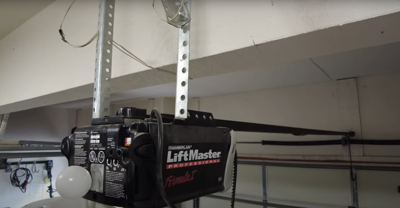 Technician repairing a garage door opener in Myakka City – professional garage door repair services.